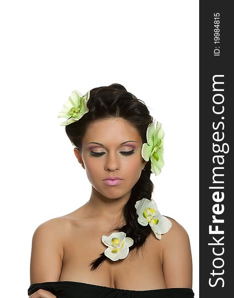 Attractive young beautiful natural model woman with orchid flower on head with hairstyle and eye makeup isolated over white background. Spring, summer girl, concept of healthy lifestyle metaphor. Attractive young beautiful natural model woman with orchid flower on head with hairstyle and eye makeup isolated over white background. Spring, summer girl, concept of healthy lifestyle metaphor