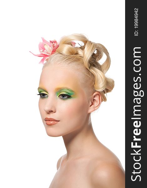 Attractive young beautiful natural model woman with orchid flower on head with hairstyle and eye makeup isolated over white background. Spring, summer girl, concept of healthy lifestyle metaphor. Attractive young beautiful natural model woman with orchid flower on head with hairstyle and eye makeup isolated over white background. Spring, summer girl, concept of healthy lifestyle metaphor