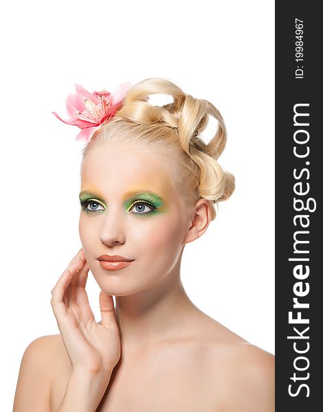 Attractive young beautiful natural model woman with orchid flower on head with hairstyle and eye makeup isolated over white background. Spring, summer girl, concept of healthy lifestyle metaphor. Attractive young beautiful natural model woman with orchid flower on head with hairstyle and eye makeup isolated over white background. Spring, summer girl, concept of healthy lifestyle metaphor