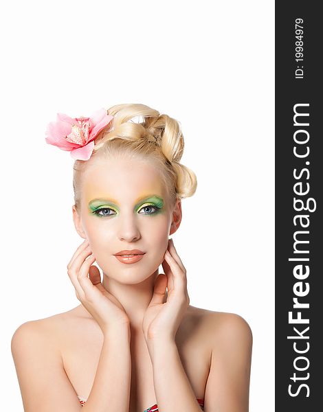 Attractive young beautiful natural model woman with orchid flower on head with hairstyle and eye makeup isolated over white background. Spring, summer girl, concept of healthy lifestyle metaphor. Attractive young beautiful natural model woman with orchid flower on head with hairstyle and eye makeup isolated over white background. Spring, summer girl, concept of healthy lifestyle metaphor