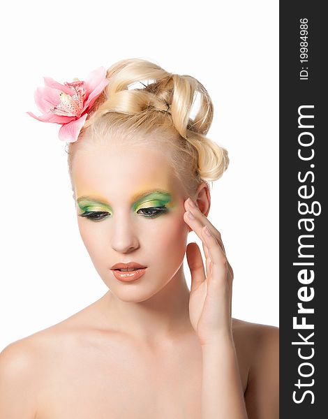 Attractive young beautiful natural model woman with orchid flower on head with hairstyle and eye makeup isolated over white background. Spring, summer girl, concept of healthy lifestyle metaphor. Attractive young beautiful natural model woman with orchid flower on head with hairstyle and eye makeup isolated over white background. Spring, summer girl, concept of healthy lifestyle metaphor