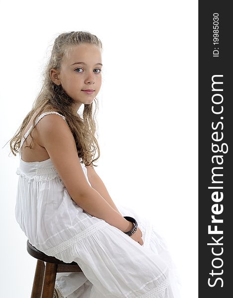 Blonde girl posing near chair