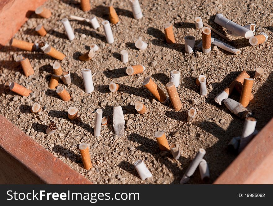 Cigarettes butts on an ashtray. Stop smoking issues