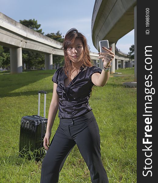 Asian Chinese girl posing cooly in front of tracks