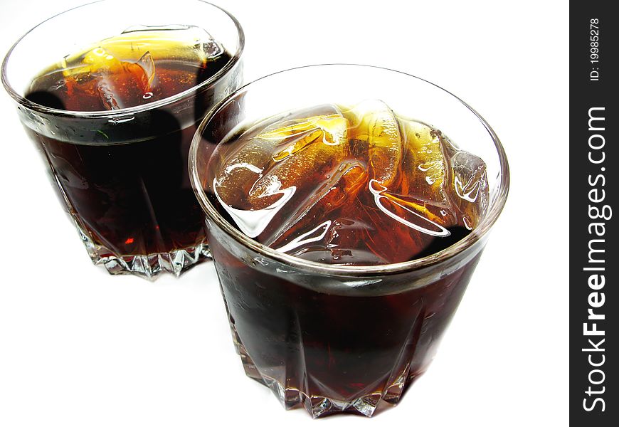 Two glasses of cola lemonade with ice