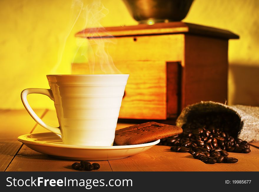 Coffee, coffee beans and coffee grinder on the table. Coffee, coffee beans and coffee grinder on the table