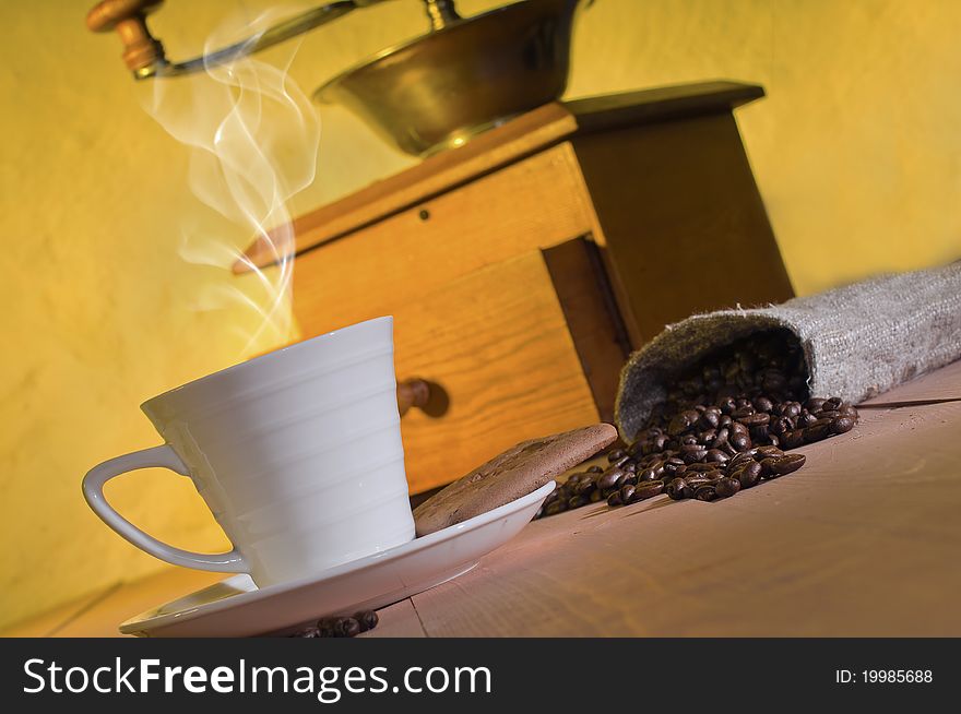Coffee, coffee beans and coffee grinder on the table. Coffee, coffee beans and coffee grinder on the table