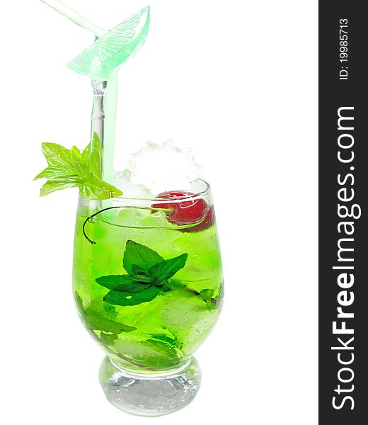 Alcohol green curacao liqueur cocktail with ice and cherry