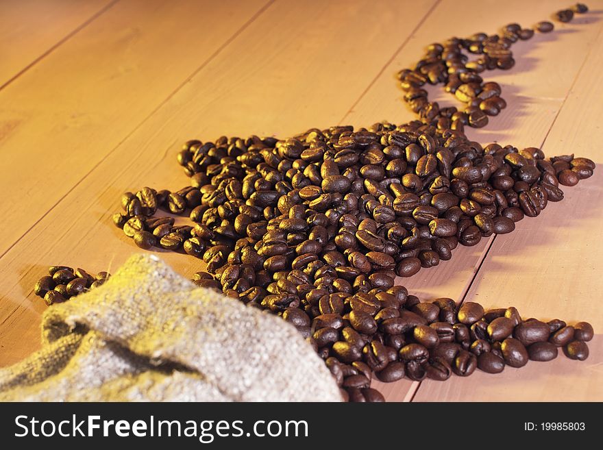 Coffee beans in the form of cups on the table. Coffee beans in the form of cups on the table