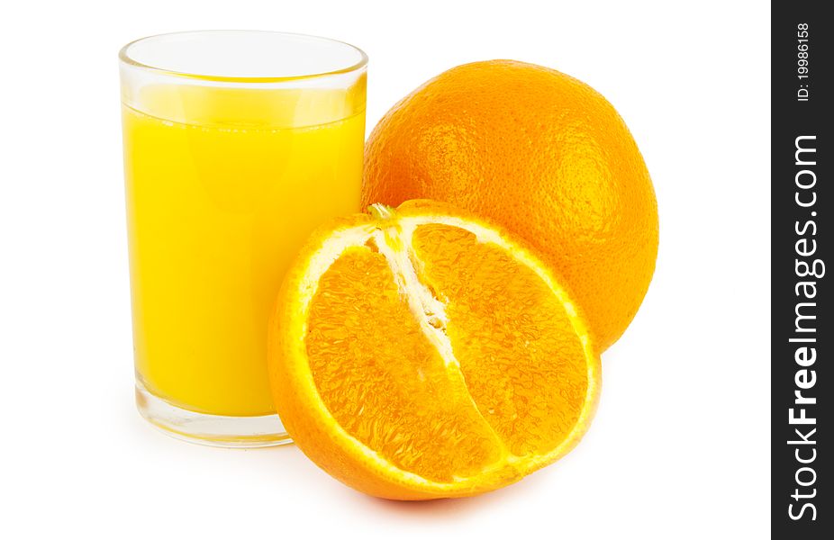 Orange jusice in glass and two oranges on white background. Orange jusice in glass and two oranges on white background