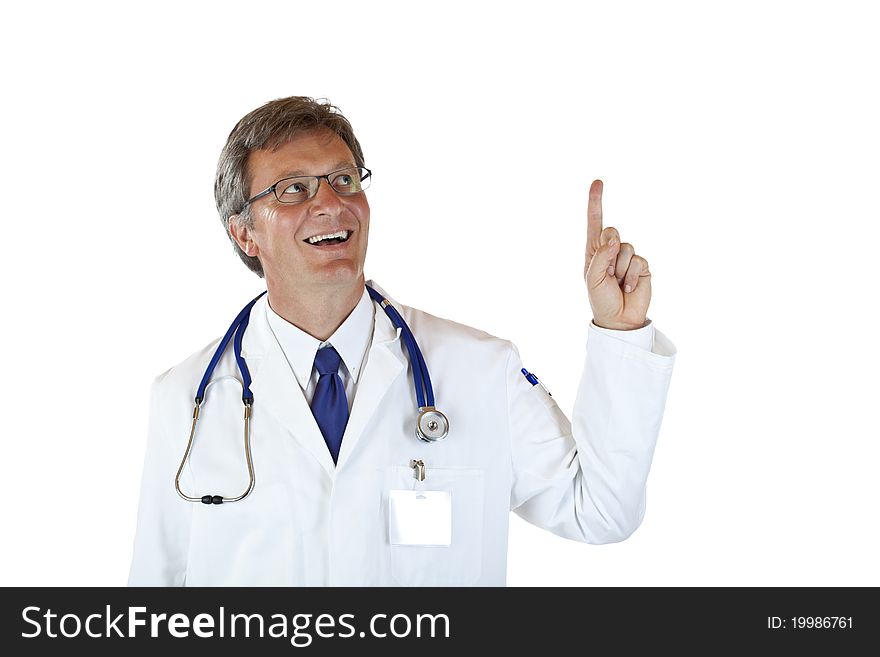 Elderly doctor looks and points at copy space