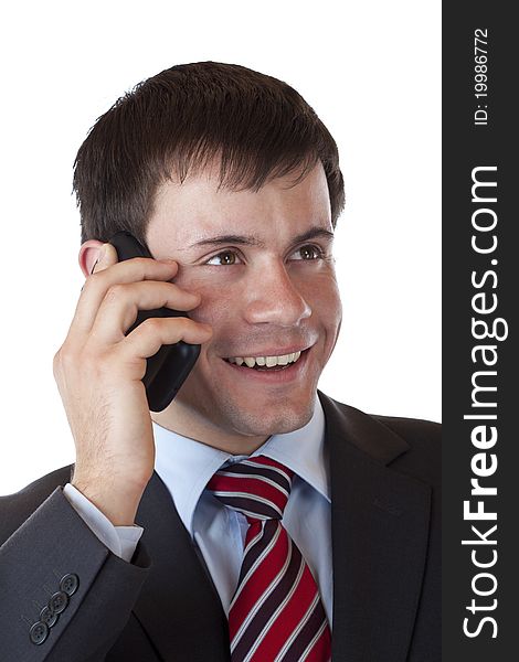 Close-up of a young businessman phoning happily with mobile. Isolated on white background. Close-up of a young businessman phoning happily with mobile. Isolated on white background.