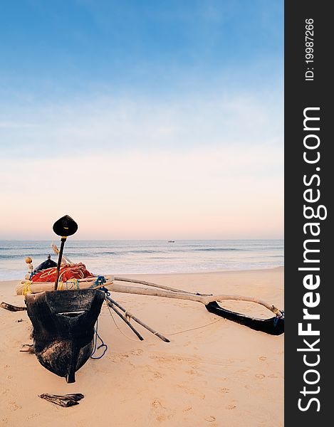 Old fishing boat on the lonely beach