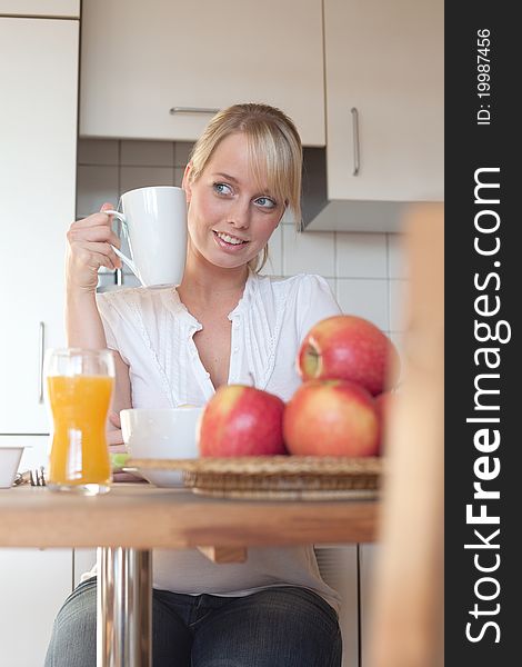 Young Blond Woman With Her Breakfast