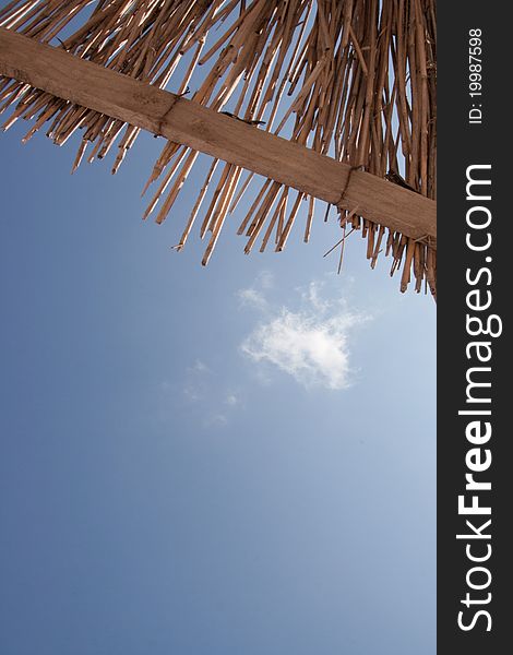 A reed umbrella on beach