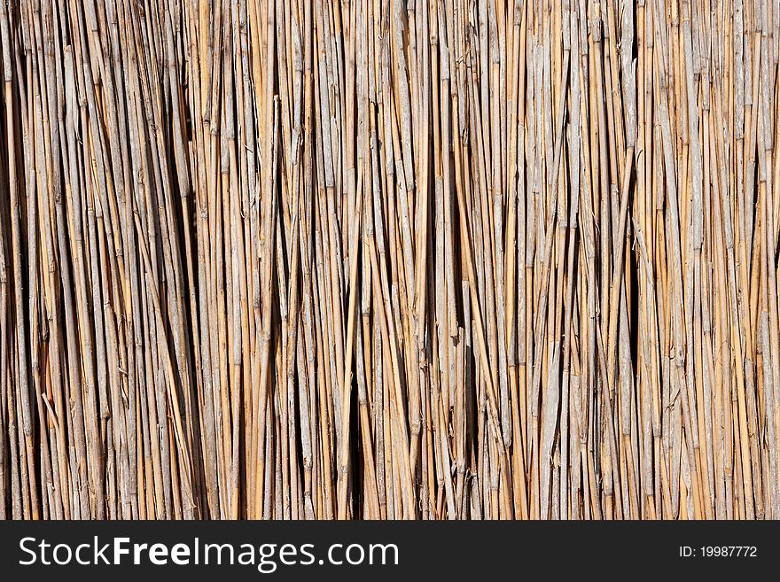 A reed umbrella on beach