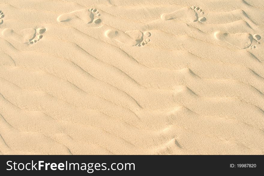 Foot marks on a sand dune. Foot marks on a sand dune