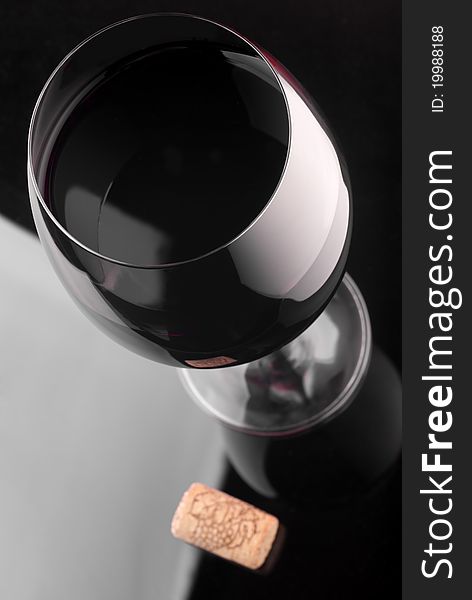 Glass of red wine and wine cork. Glass of red wine and wine cork