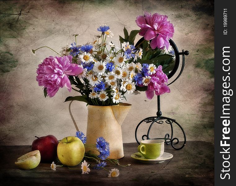 Still life with pi-mesons, corn-flowers and camomiles in a vase, alongside taken an apple. Still life with pi-mesons, corn-flowers and camomiles in a vase, alongside taken an apple