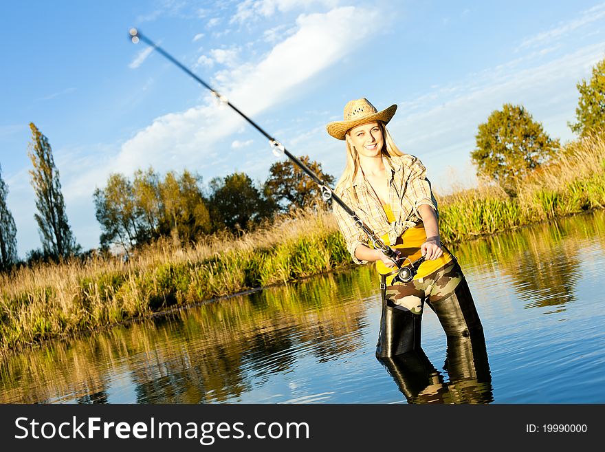 Young woman fishing in pond. Young woman fishing in pond