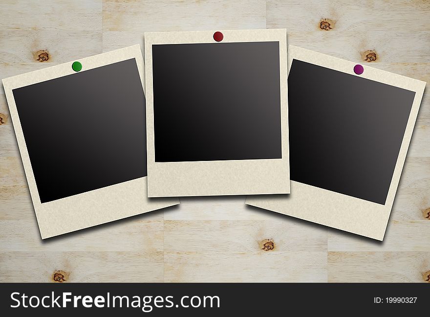 Blank photos on a wood background