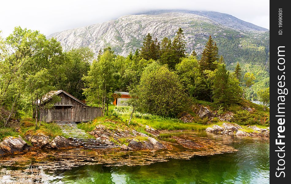 Among mountains and clouds in a Norwegian fjord. Among mountains and clouds in a Norwegian fjord.