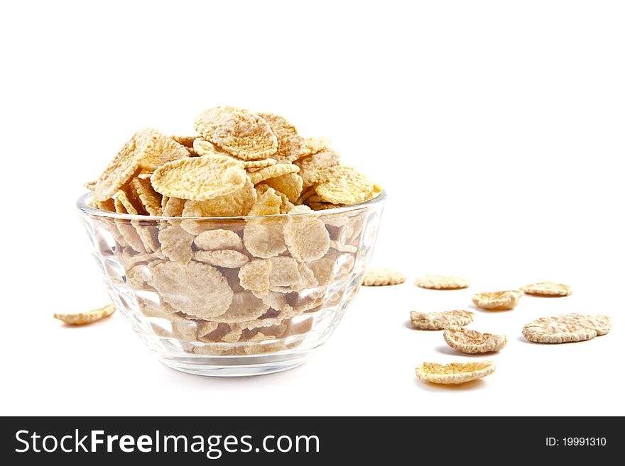 Bowl of dried cornflakes on white