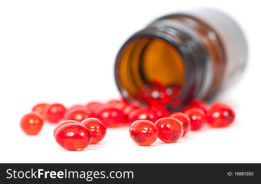 Pills and bottle on a white background