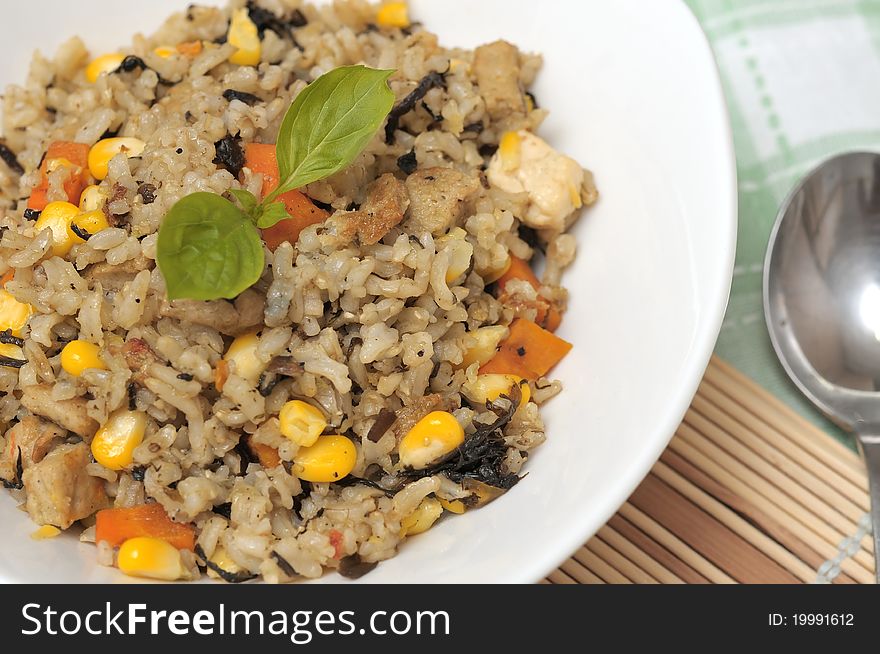 Tasty vegetable rice prepared with colorful and healthy ingredients.