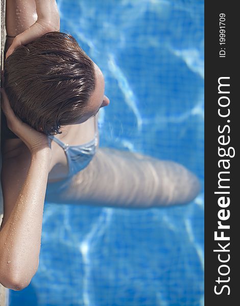 Woman in swimming pool - shot from above