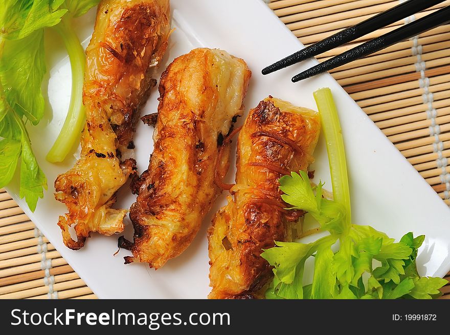 Tasty oriental style deep fried prawns on white plate. Tasty oriental style deep fried prawns on white plate.