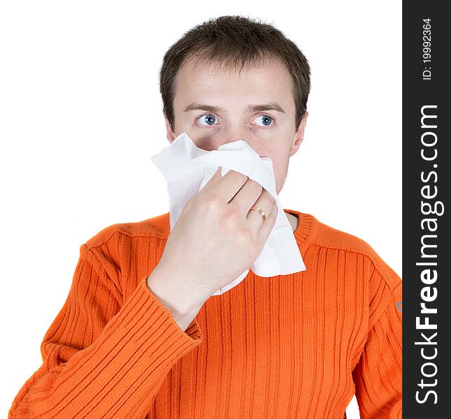 The young man wipes a nose a scarf isolated