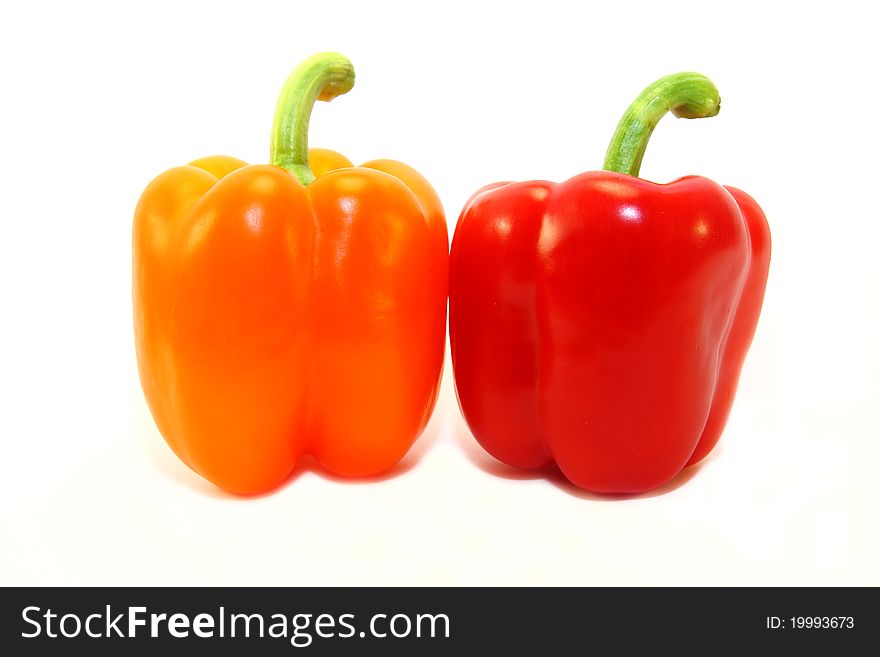 Rosy and red peppers isolated on white background