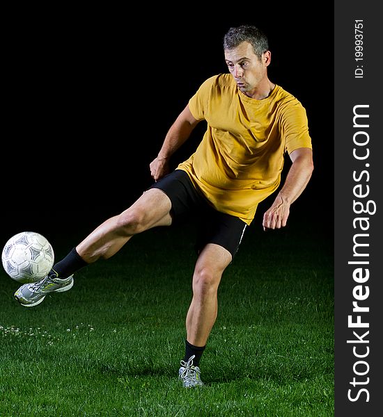 Soccer player shooting a ball