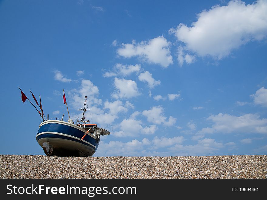 Fishing boat on a summers day on the beach. Fishing boat on a summers day on the beach