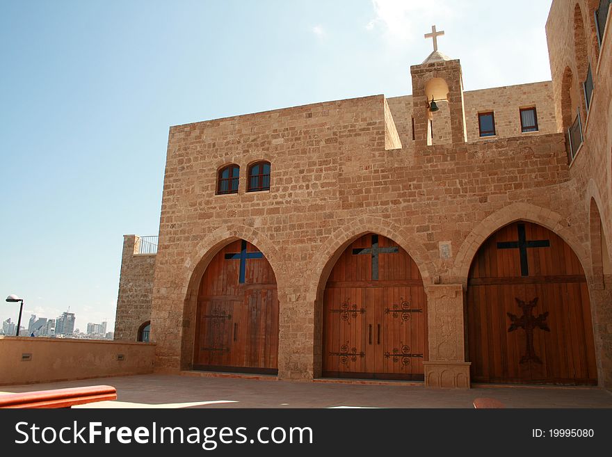 Entrance to the armenian christian monastery of Jaffo in Tel Aviv with the Mediterranean sea and Tel Aviv in background. Entrance to the armenian christian monastery of Jaffo in Tel Aviv with the Mediterranean sea and Tel Aviv in background.