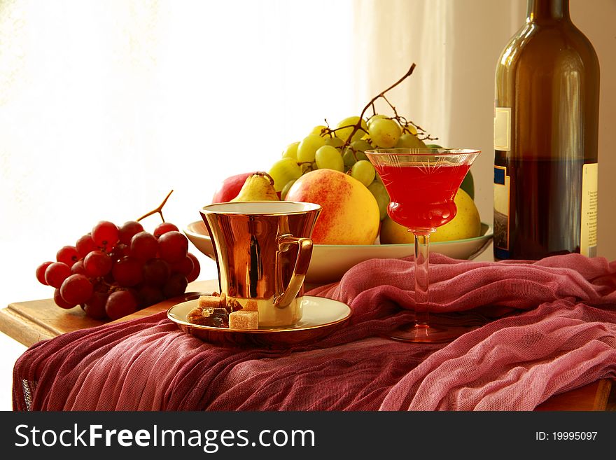 Fruits,red Wine,coffee Cup On Blurred Background.