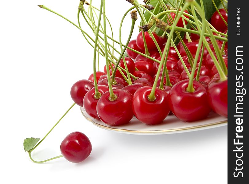Cherry With A Branch On A Dish
