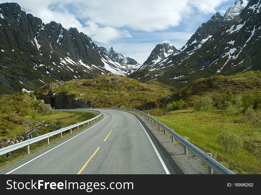 Road to norwegian mountains on sunny day