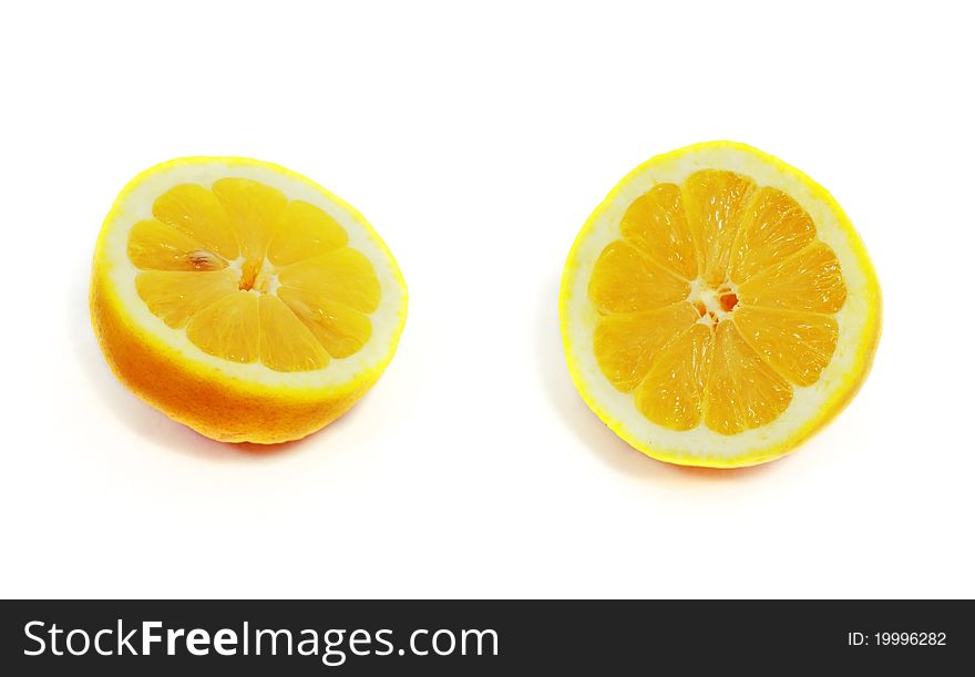 Fresh juicy cut lemon isolated on white background