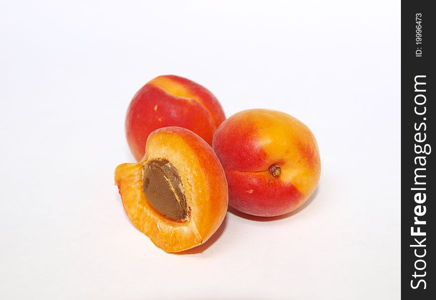 Two apricots on a background