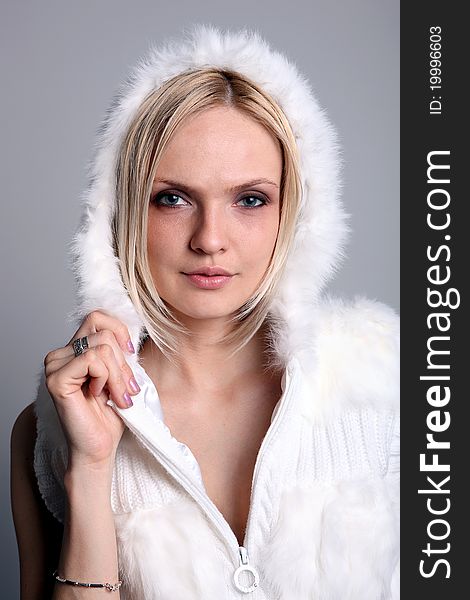 Pretty blond girl in a white hood