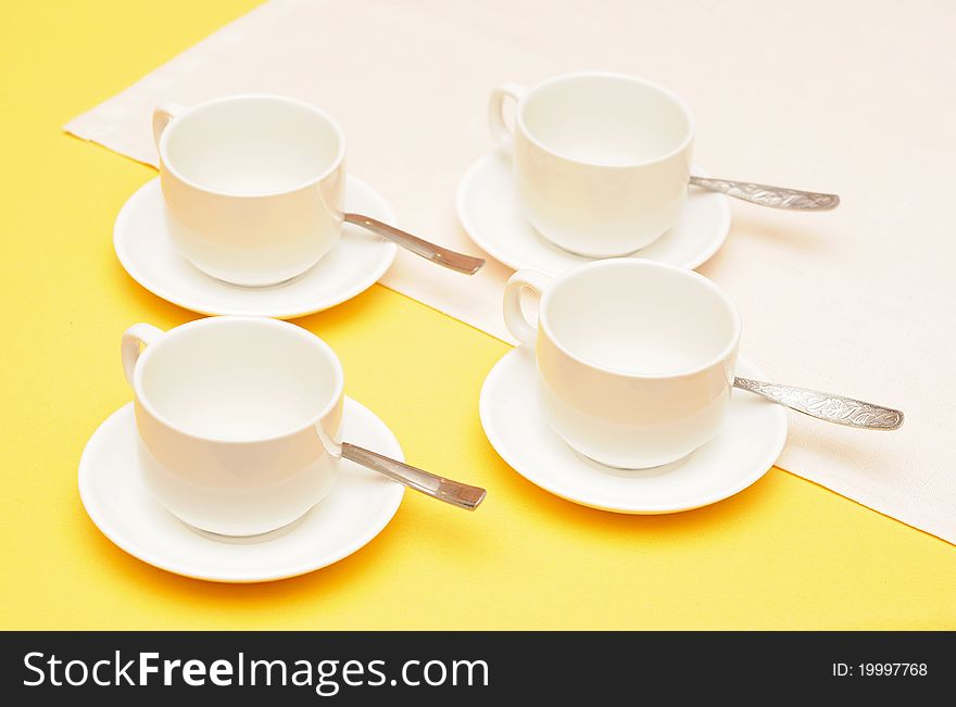 Empty coffee cups with saucers