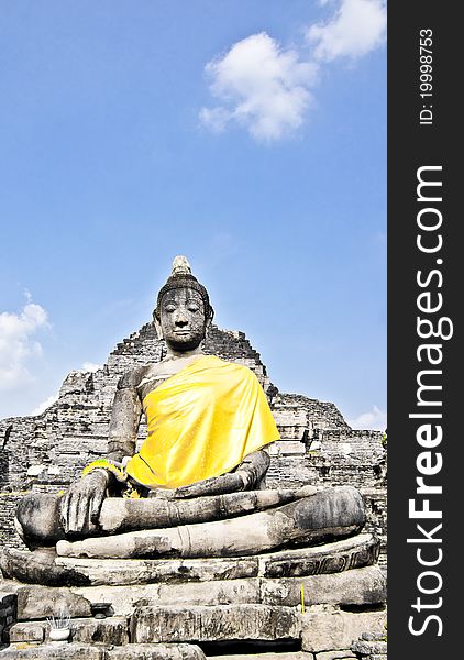 The scene of Thailand about Buddha statue with yellow fabric