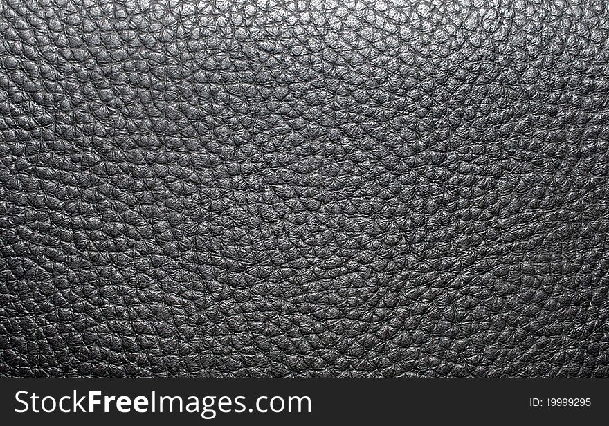 Natural qualitative black leather texture. Close up