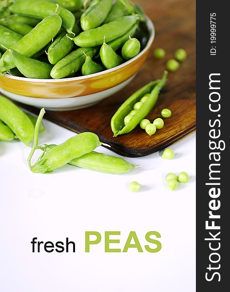 Fresh green peas isolated on white background