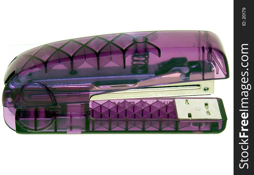 Basic dollar store purple translucent stapler shot on white. Basic dollar store purple translucent stapler shot on white.