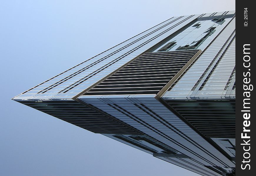 Corner of a modern glass building. Corner of a modern glass building.