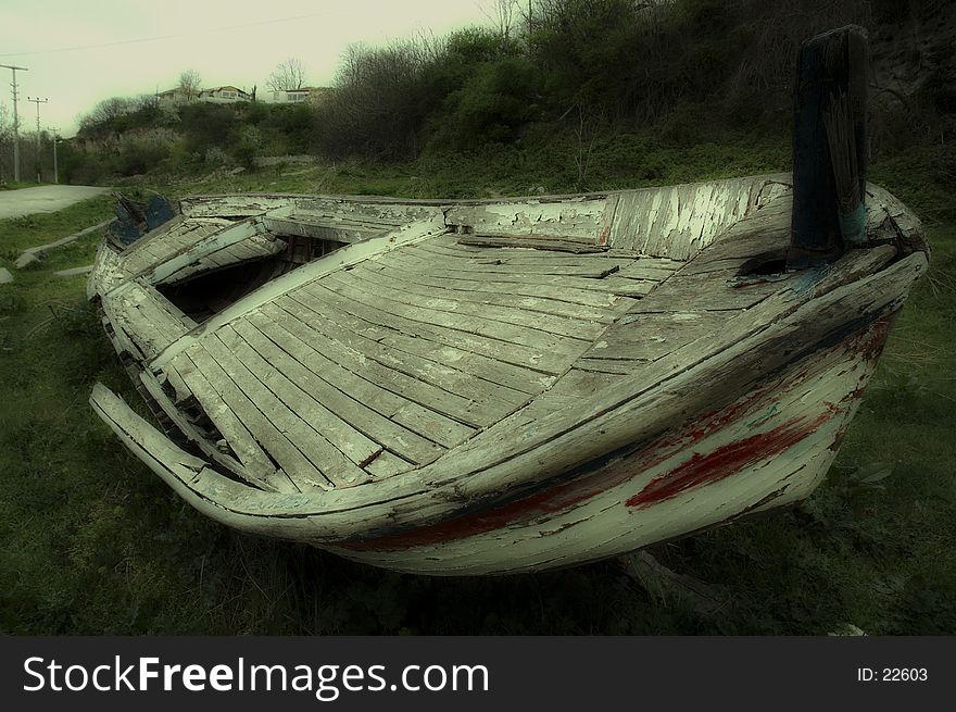 Ancient (retired) boat in Kiyikoy / Turkey. Soft focus version (dreamy atmosphere). Ancient (retired) boat in Kiyikoy / Turkey. Soft focus version (dreamy atmosphere).