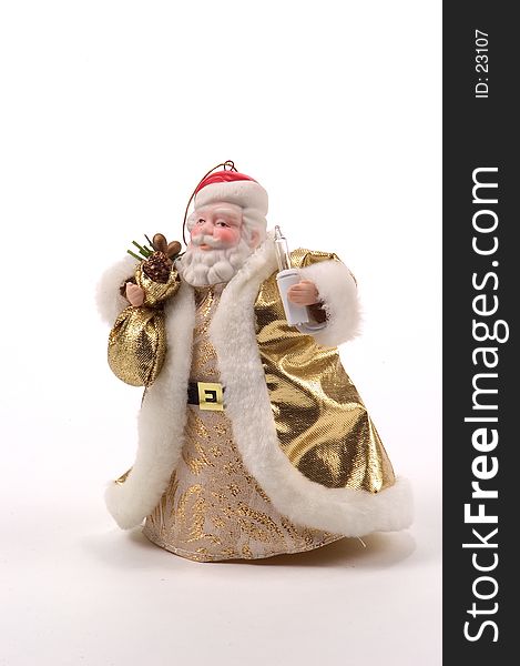 A Christmas Tree ornament representing Santa Claus in a golden rode holding a torch (tree light). A Christmas Tree ornament representing Santa Claus in a golden rode holding a torch (tree light).